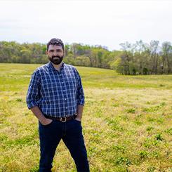 l dwayne estes standing in field