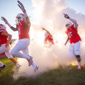 Football players entering the field